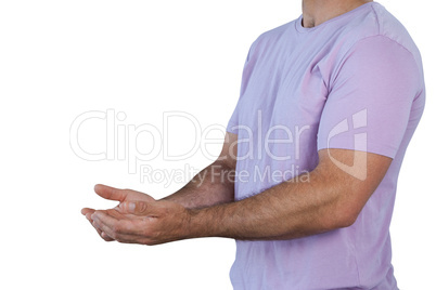 Mid section man with hands cupped holding invisible product
