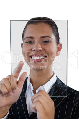 Close up portrait of young businesswoman using glass interface