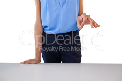 Businesswoman holding something at table