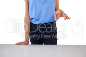 Businesswoman holding something at table