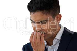 Close up of worried businessman biting nails