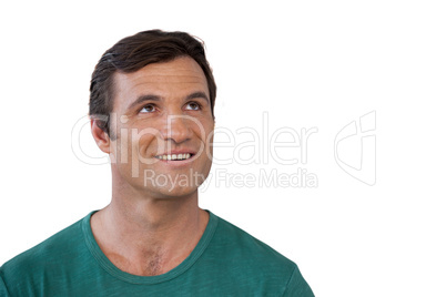 Thoughtful smiling mature man wearing green casuals