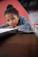 Close up of thoughtful businesswoman leaning on desk