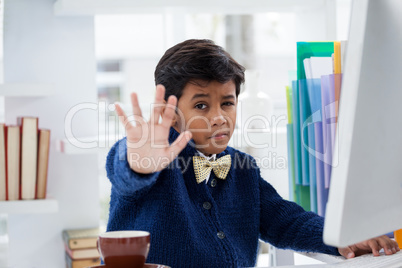 Portrait of businessman showing hand