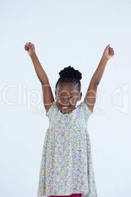 Portrait of cheerful businesswoman with arms raised