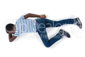 Boy lying on white background