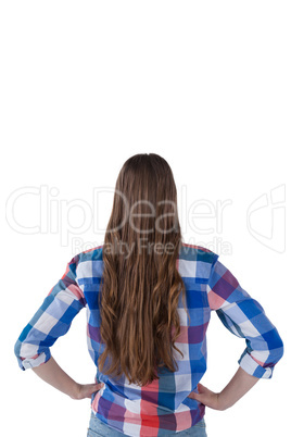 Teenage girl standing against white background