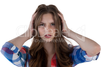 Teenage girl standing against white background