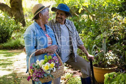 Senior couple walking in garden