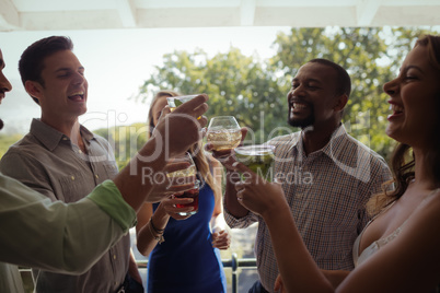 Group of friends toasting cocktail glasses