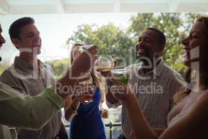 Group of friends toasting cocktail glasses