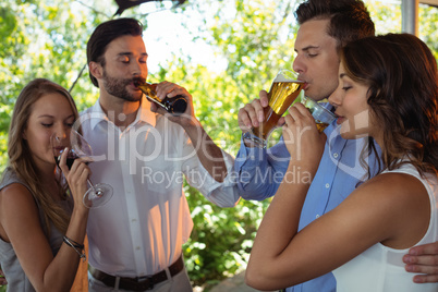 Friends having a alcohol at counter