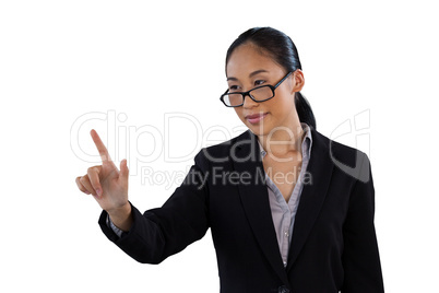 Businesswoman wearing eyeglasses while using invisible interface