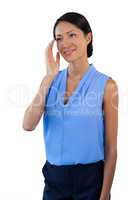 Smiling thoughtful businesswoman looking away while gesturing
