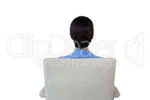 Rear view of businesswoman sitting on chair