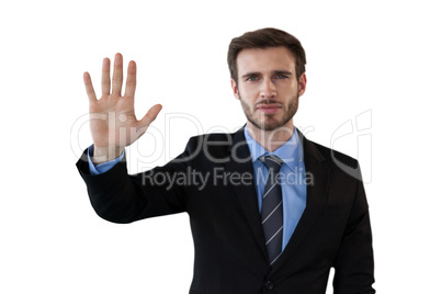 Businessman in suit touching invisible interface