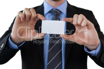 Mid section of businessman holding paper