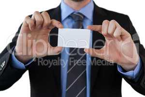 Mid section of businessman holding paper