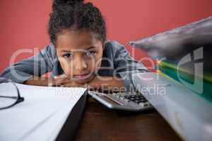 Close up portrait of girl pretending as businesswoman leaning on desk
