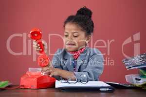 Businesswoman using land line phone