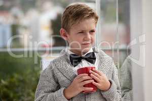 Thoughtful businessman looking away while holding coffee cup