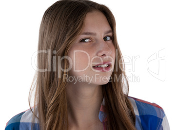 Teenager girl smiling against white background