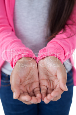 Girl pretending to be hold invisible object