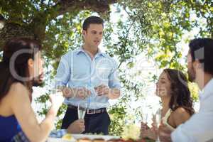 Group of friends toasting champagne glasses