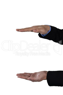 Cropped hands of businessman holding invisible product