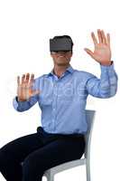 Businessman sitting chair while wearing vr glasses