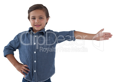 Happy boy posing against white background