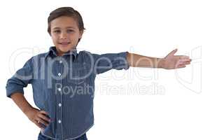 Happy boy posing against white background