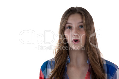 Teenage girl standing against white background