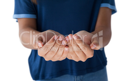 Girl with hand cupped against white background