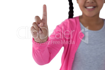 Girl pressing an invisible virtual screen