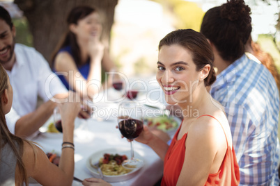 Woman holding a wine glass in restaurant