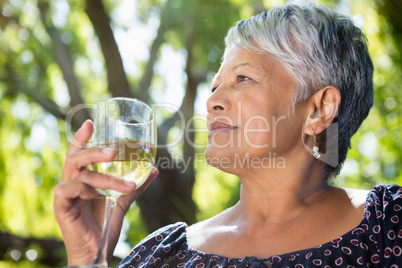 Senior woman drinking wine