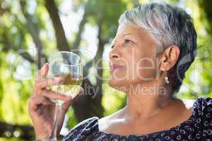 Senior woman drinking wine