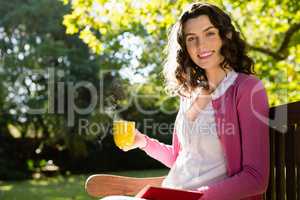 Portrait of smiling woman having a cup of coffee