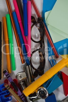 Various school supplies and digital tablet on white background