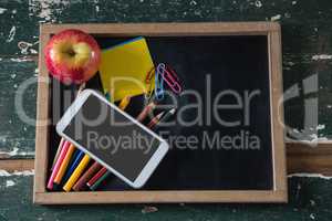 Various stationery with apple and mobile phone