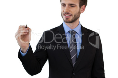Smiling businessman writing on invisible interface