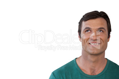Close-up of smiling mature man looking up