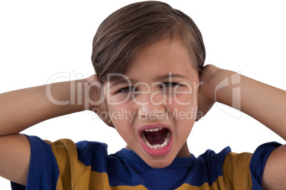 Cute boy shouting against white background