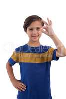 Cute boy gesturing okay hand sign