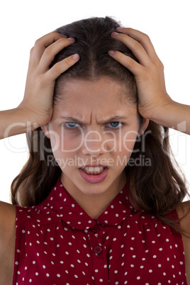 Teenage girl standing against white background