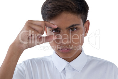 Boy gesturing against white background