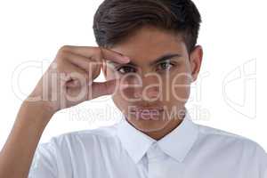 Boy gesturing against white background