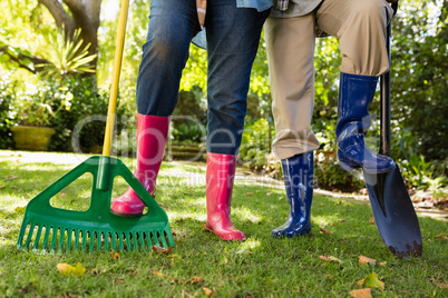 Senior couple standing in garden on a sunny day