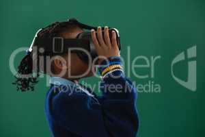 Schoolgirl using virtual reality headset